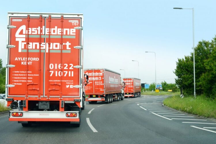 Old lorries convoy on road